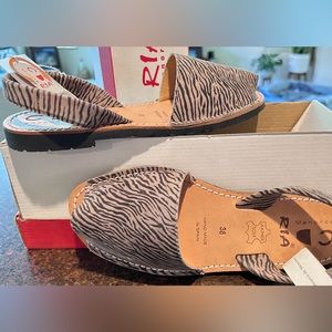 Beautiful espadrilles made in Spain,color light  brown with black zebra lines!!